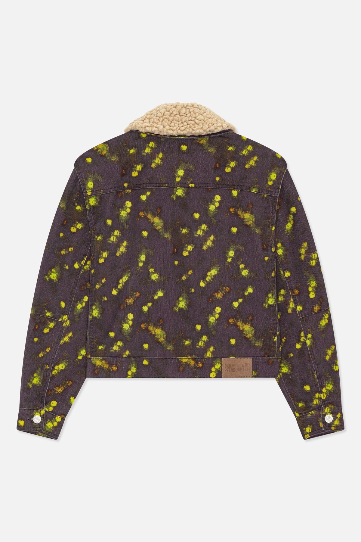 Back view of a dark jacket with scattered yellow-green floral print and a thick cream textured collar