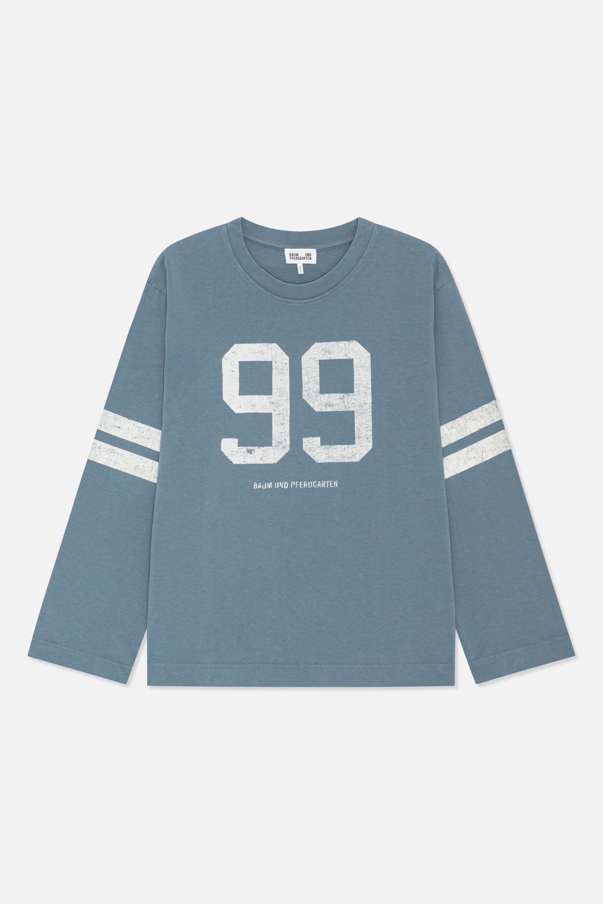 Blue-grey long-sleeved crewneck shirt with a distressed white “99” graphic and twin sleeve stripes, shown from the front.