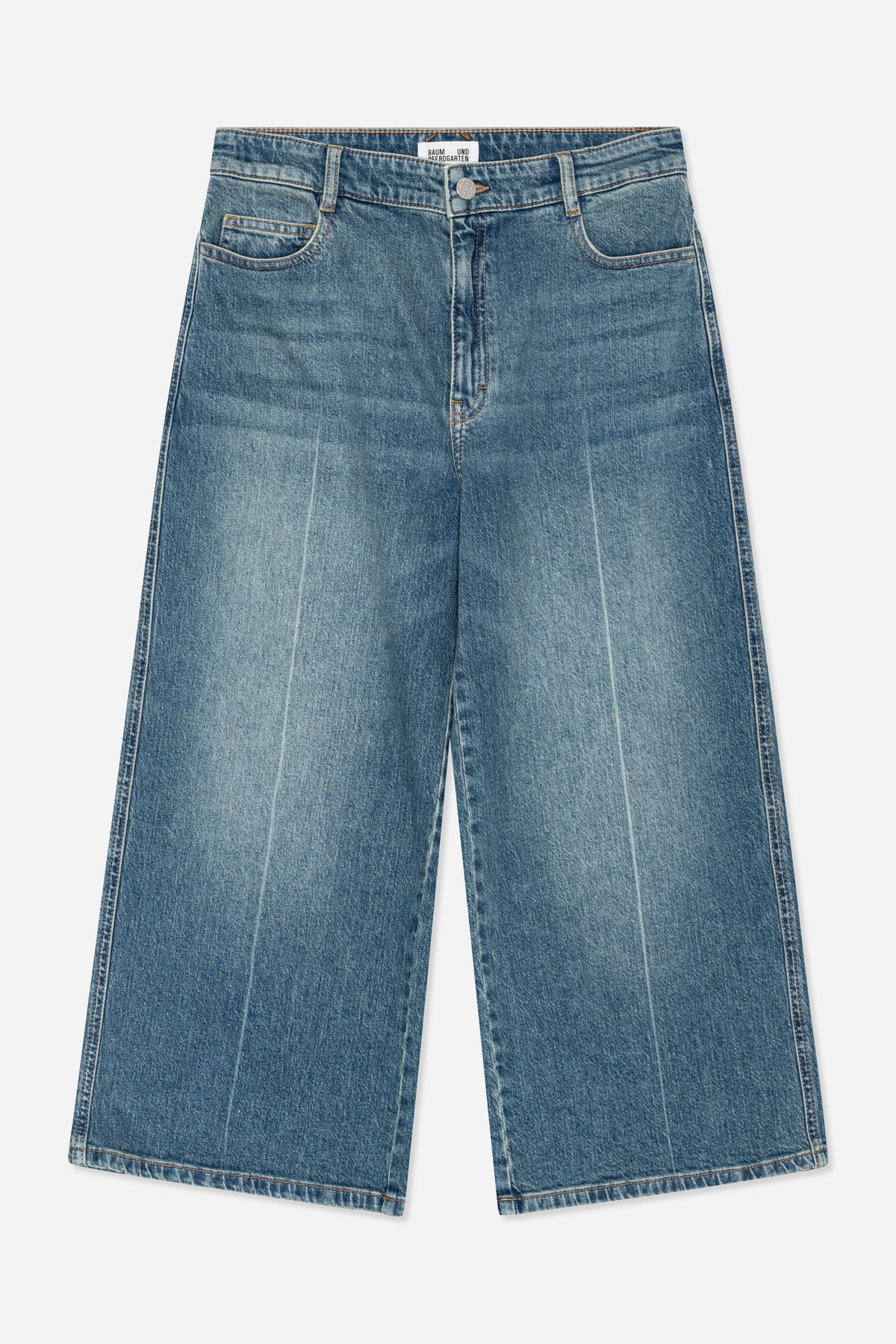Front view of blue washed denim jeans with orange stitching, belt loops, a button fly and curved front pockets.