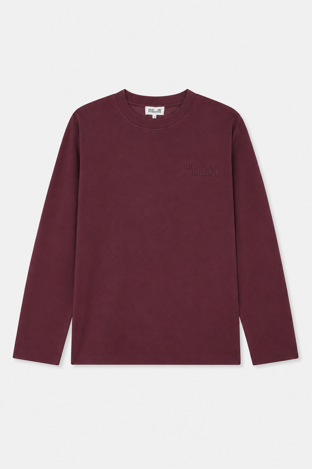 Front view of a burgundy long-sleeved crew-neck shirt with subtle tonal Baum und Pferdgarten lettering on the chest.